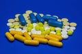 Scattered colored medications and pills