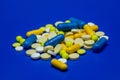 Scattered colored medications and pills