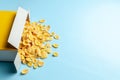 Scattered cornflakes out of the box. Dry cereal breakfast. Copy space for text. Royalty Free Stock Photo