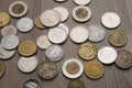 Scattered currency coins from varioys countries. Royalty Free Stock Photo