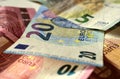 Scattered euro banknotes in denominations of five euros, ten euros, twenty euros, fifty euros, mixed banknotes as background Royalty Free Stock Photo