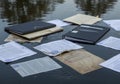 Are black binders, manila folders, and assorted papers with visible text Royalty Free Stock Photo