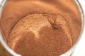 Scattered ground brown coffee in a metal jar ground coffee beans Royalty Free Stock Photo