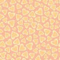 Scattered hand drawn doodle hearts in pastel yellow, pink and orange with loose scalloped edging. Seamless vector