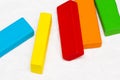 Scattered heap of toy colored wooden bricks on a white background Royalty Free Stock Photo