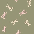 Scattered little bows seamless vector pattern.