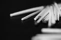 Scattered matches on dark background. Black and white Royalty Free Stock Photo