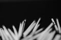 Scattered matches on dark background. Black and white Royalty Free Stock Photo