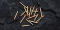 Scattered Matches on Dark Surface Texture Detail Closeup Photography Royalty Free Stock Photo