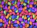 Scattered multi-colored jelly beans. Candy background image. 3D Rendering.