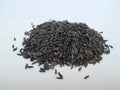 Scattered niger seed with shallow depth of field. Pile and heap of Black Color Uchellu/Gurellu. These seeds are used in masalas by