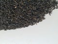 Scattered niger seed with shallow depth of field. Pile and heap of Black Color Uchellu/Gurellu. These seeds are used in masalas by Royalty Free Stock Photo