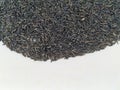 Scattered niger seed with shallow depth of field. Pile and heap of Black Color Uchellu/Gurellu. These seeds are used in masalas by Royalty Free Stock Photo