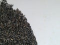 Scattered niger seed with shallow depth of field. Pile and heap of Black Color Uchellu/Gurellu. These seeds are used in masalas by Royalty Free Stock Photo
