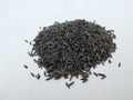 Scattered niger seed with shallow depth of field. Pile and heap of Black Color Uchelluor Gurellu. These seeds are used in masalas Royalty Free Stock Photo