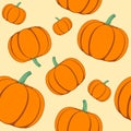 Scattered orange color pumpkins seamless vector pattern.