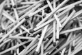 Scattered on a pile of wooden sticks matches. Black and white