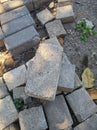 scattered piles of paving stones