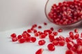 Scattered pomegranate seeds from the bowl Royalty Free Stock Photo