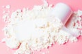 Scattered protein and scoop on pink background top view Royalty Free Stock Photo