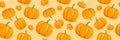 Scattered orange color pumpkins seamless vector background.