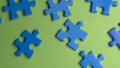 scattered puzzle pieces on colored background Royalty Free Stock Photo