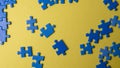 Scattered puzzle pieces on colored background