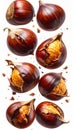 Scattered Roasted Chestnuts with Brown Shells and Golden Interiors on White Background Royalty Free Stock Photo
