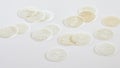 Scattered sacramental Hosties on white Royalty Free Stock Photo