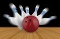 Scattered skittle and bowling ball on wooden floor