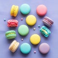 Scattered small candy balls in matching hues complement the macarons Royalty Free Stock Photo