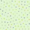 Scattered small colored stars. Cute seamless pattern for children.