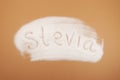 Scattered Stevia sweetener with inscription Stevia. Design element. Stevioside powder, natural sugar substitute. Food additive Royalty Free Stock Photo