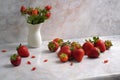 scattered strawberries on a marble countertop Royalty Free Stock Photo