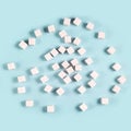 Scattered sugar cubes on light blue background in random pattern Royalty Free Stock Photo