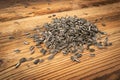 Scattered Sunflower Seeds Pile, Striped Raw Seeds on Wood Rusric Background Top View Royalty Free Stock Photo