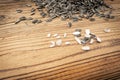 Scattered Sunflower Seeds, Striped Raw Seeds on Wood Background Texture Top View Royalty Free Stock Photo