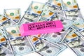 Scattered US dollars with a pink eraser on top with really big mistakes message. Royalty Free Stock Photo