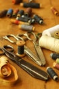 Scattered vintage scissors and thread spools