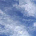 Scattered white clouds over the blue sky at daytime Royalty Free Stock Photo
