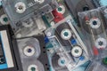 A scattering of audio cassettes on a blue wooden background