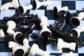 Scattering black and white chess pieces chessboard Royalty Free Stock Photo