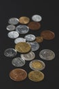 A scattering of coins on a black background Royalty Free Stock Photo