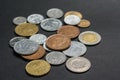 A scattering of coins on a black background Royalty Free Stock Photo