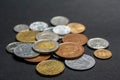 A scattering of coins on a black background Royalty Free Stock Photo