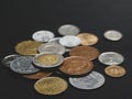 A scattering of coins on a black background Royalty Free Stock Photo