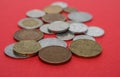 A scattering of coins on the red background Royalty Free Stock Photo