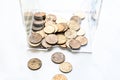 Scattering of coins on a white background close-up, piggy bank change Royalty Free Stock Photo