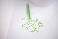 Scattering of green stars glitter on white background