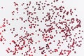 A scattering of red hearts on a white background. Texture for Valentine`s day Royalty Free Stock Photo